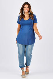 Model Laura wearing size 12 of the Softly Swinging Bamboo Tee in colour BlueJeans (Blue), from the front, showing the whole outfit