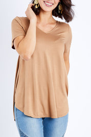 Model Andrea wearing size 10 of the Softly Swinging Bamboo Tee in colour Camel, from the front, cropped image