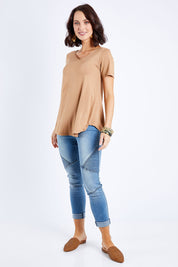 Model Andrea wearing size 10 of the Softly Swinging Bamboo Tee in colour Camel, from the front, showing the whole outfit