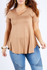 Model Laura wearing size 14 of the Softly Swinging Bamboo Tee in colour Camel, from the front, cropped image