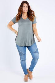 Model Laura wearing size 14 of the Softly Swinging Bamboo Tee in colour Fern (Green), from the front, showing the whole outfit