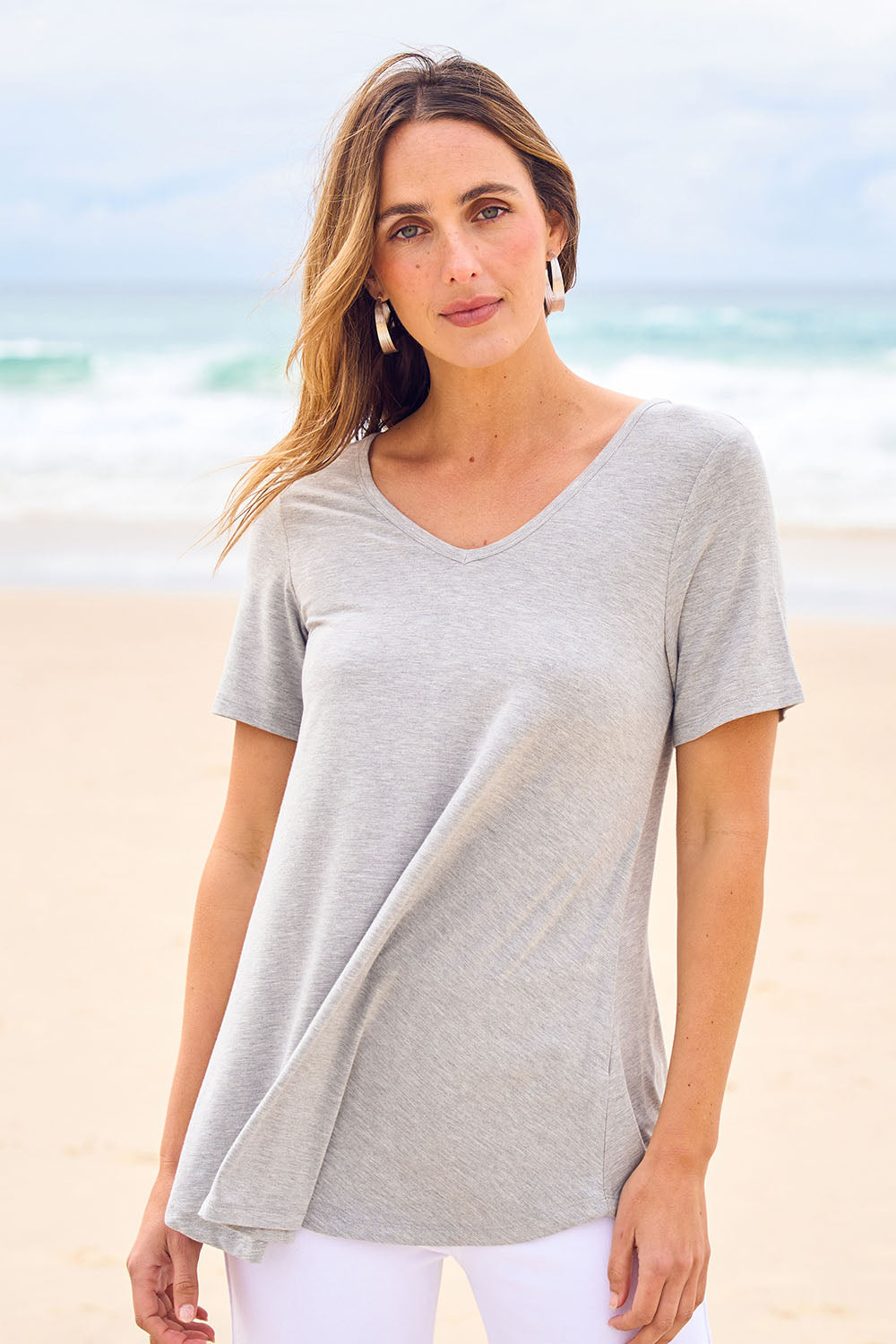 Model Tegan wearing size 10 of the Softly Swinging Bamboo Tee in colour Greymarle (Grey), from the front, showing the whole outfit