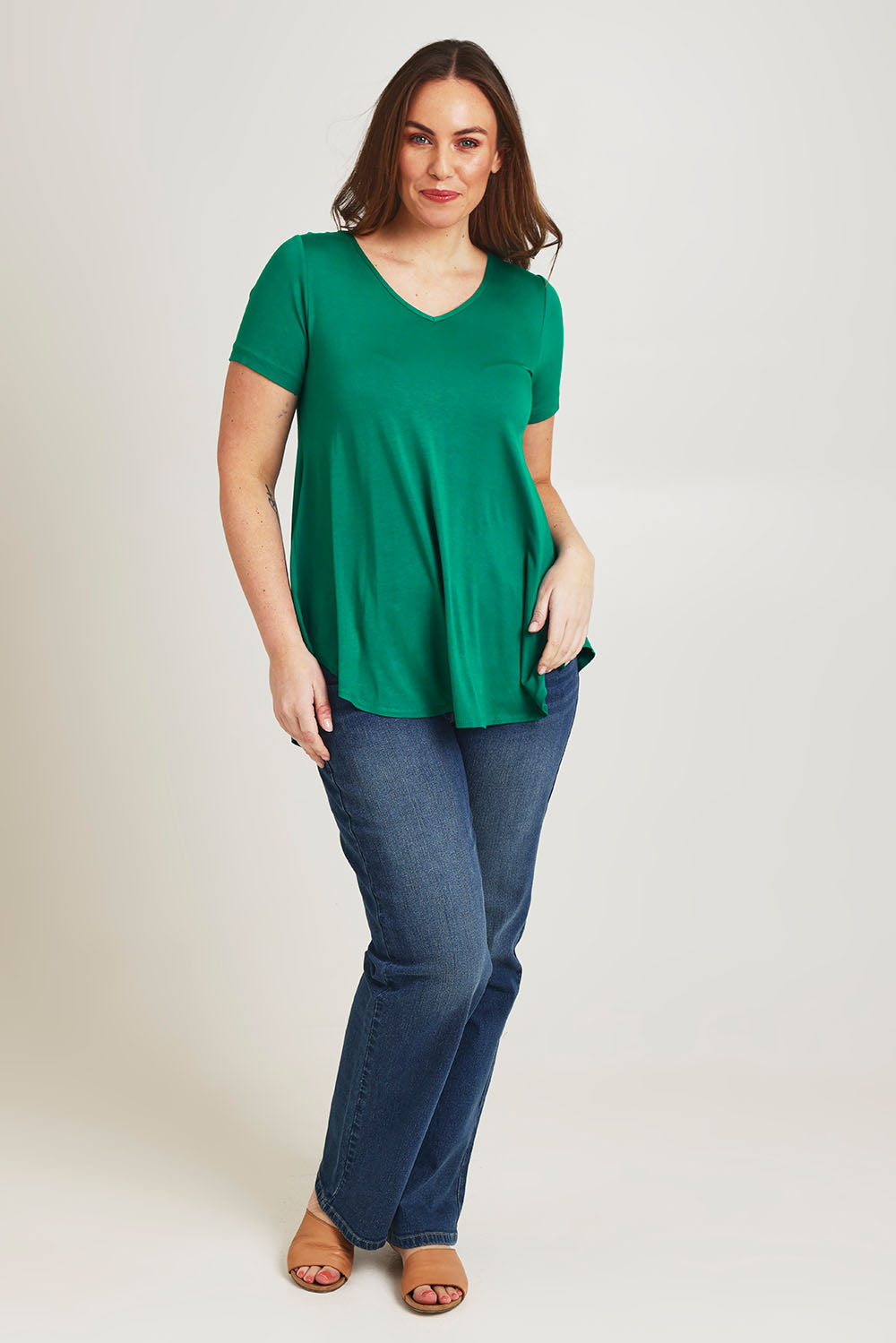 Model Jane wearing size 14 of the Softly Swinging Bamboo Tee in colour Lushgreen (Green), from the front, showing the whole outfit
