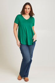 Model Jane wearing size 14 of the Softly Swinging Bamboo Tee in colour Lushgreen (Green), from the front, showing the whole outfit