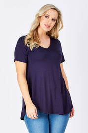 Model Jess wearing size 12 of the Softly Swinging Bamboo Tee in colour Navy (Blue), from the front, cropped image