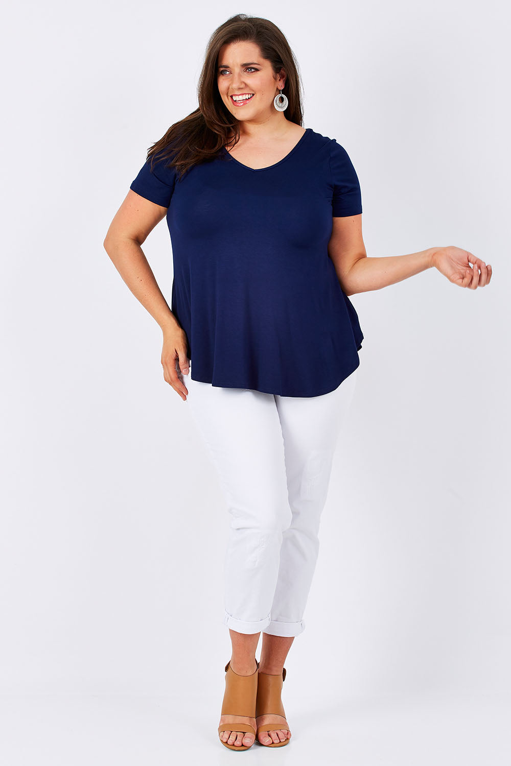 Model Mae wearing size 16 of the Softly Swinging Bamboo Tee in colour Navy (Blue), from the front, showing the whole outfit