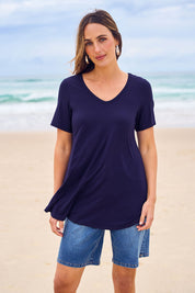 Model Tegan wearing size 10 of the Softly Swinging Bamboo Tee in colour Navy (Blue), from the front, showing the whole outfit