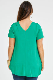 Model Laura wearing size 14 of the Softly Swinging Bamboo Tee in colour Verde (Green), from the back