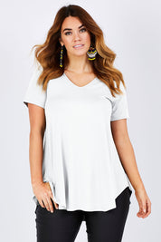 Model Laura wearing size 12 of the Softly Swinging Bamboo Tee in colour White (White), from the front, cropped image