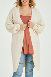 Model Jess wearing size L of the Adjourn To The Drawing Room Cardi in colour Buttermilk, from the front, cropped image