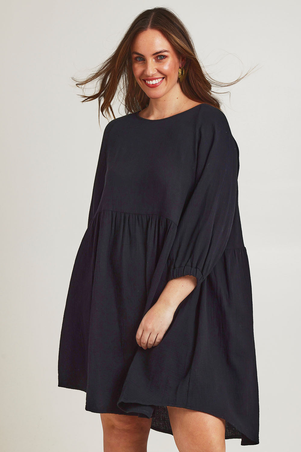Model Jane wearing size 14 of the Feeling Free Cotton Smock Dress in colour Black (Black), from the front, cropped image
