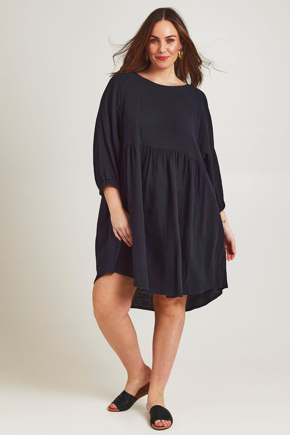 Model Jane wearing size 14 of the Feeling Free Cotton Smock Dress in colour Black (Black), from the front, showing the whole outfit