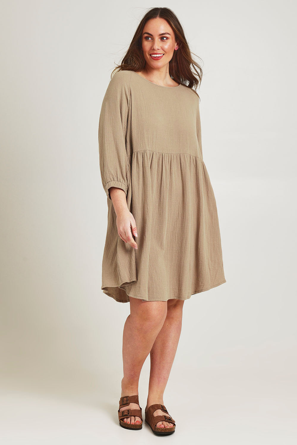 Model Jane wearing size 14 of the Feeling Free Cotton Smock Dress in colour Dust, from the front, showing the whole outfit