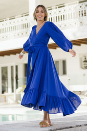 Model Tegan wearing size 10 of the La Dolce Vita Linen Wrap Maxi in colour Sapphire (Blue), from the front, showing the whole outfit