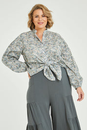 Model Fiona wearing size 16 of the You And Me Cotton Floral Blouse in colour Skyfleur (Blue), from the front, cropped image