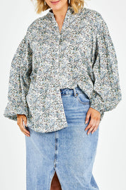 Model Jess wearing size 14 of the You And Me Cotton Floral Blouse in colour Skyfleur (Blue), from the front, cropped image