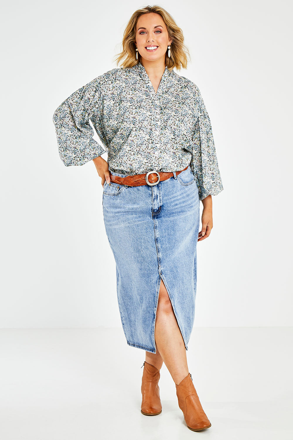 Model Jess wearing size 14 of the You And Me Cotton Floral Blouse in colour Skyfleur (Blue), from the front, showing the whole outfit