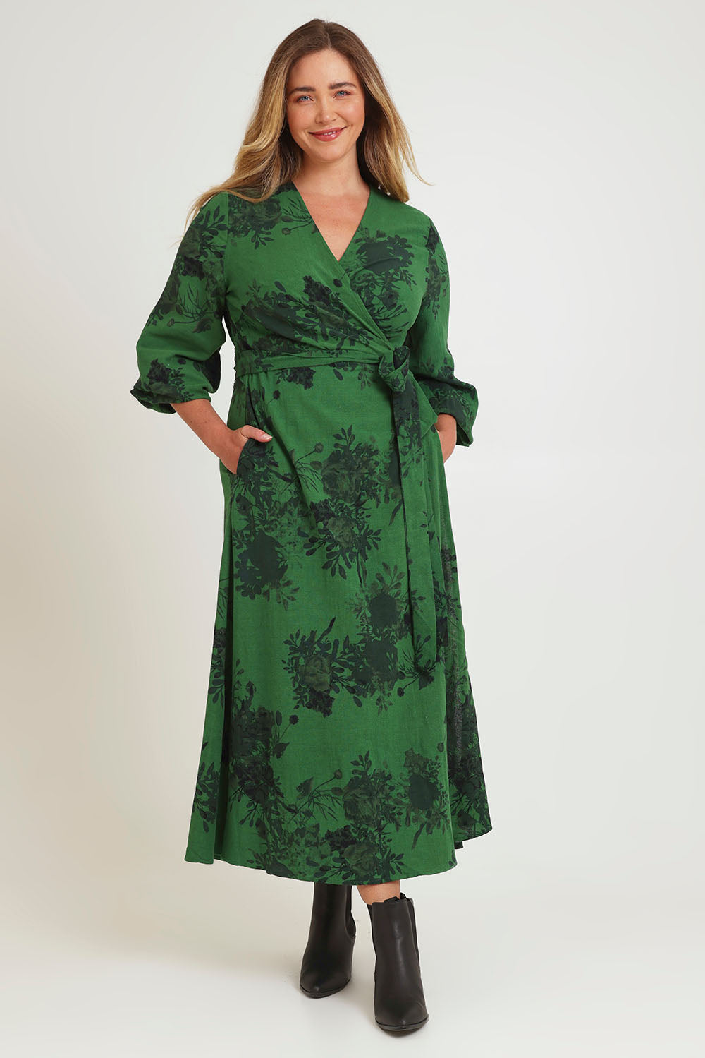 Model Chanel wearing size 16 of the Wrap Me Up In Cotton Maxi Dress in colour Emerald (Green), from the front, showing the whole outfit