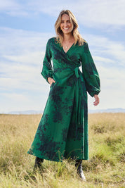 Model Tegan wearing size 10 of the Wrap Me Up In Cotton Maxi Dress in colour Emerald (Green), from the front, showing the whole outfit