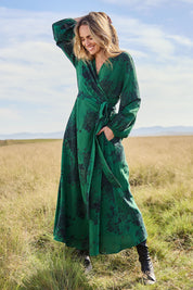 Model Tegan wearing size 10 of the Wrap Me Up In Cotton Maxi Dress in colour Emerald (Green), from the front, showing the whole outfit