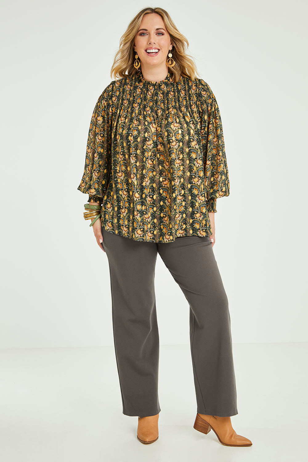 Model Jess wearing size 14 of the Meet Me At Midnight Ponte Pants in colour Olive (Green), from the front, showing the whole outfit