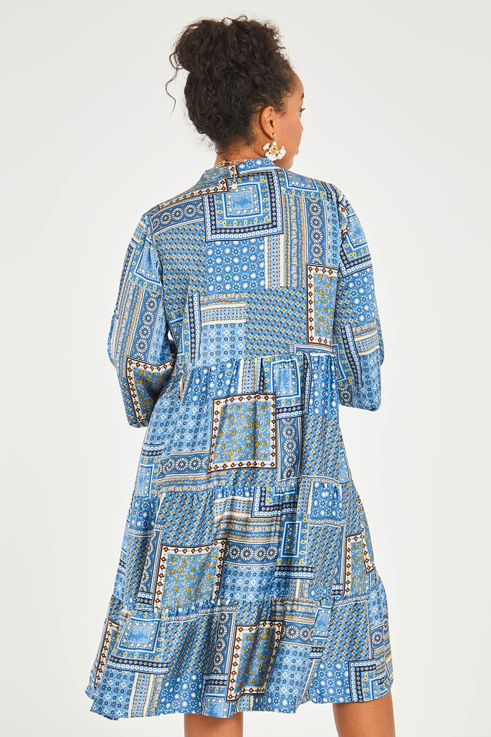 Model Noli wearing size 14 of the Floating Through The Day Midi Dress in colour Patch (Blue), from the back