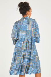 Model Noli wearing size 14 of the Floating Through The Day Midi Dress in colour Patch (Blue), from the back
