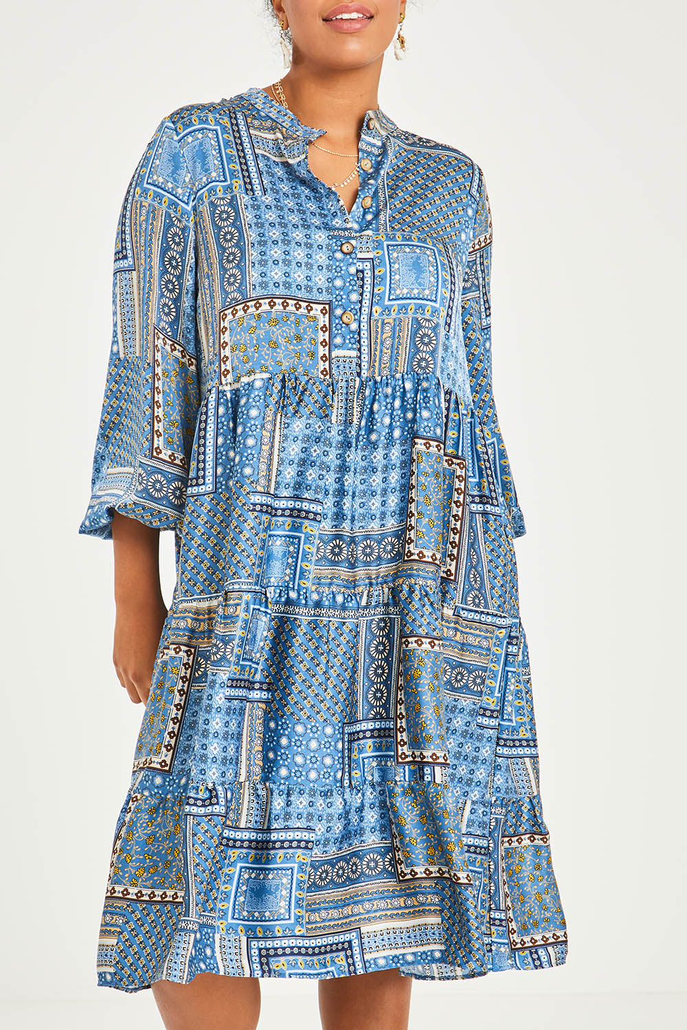 Model Noli wearing size 14 of the Floating Through The Day Midi Dress in colour Patch (Blue), from the front, cropped image