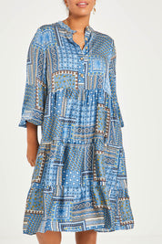 Model Noli wearing size 14 of the Floating Through The Day Midi Dress in colour Patch (Blue), from the front, cropped image