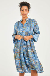 Model Noli wearing size 14 of the Floating Through The Day Midi Dress in colour Patch (Blue), from the front, cropped image