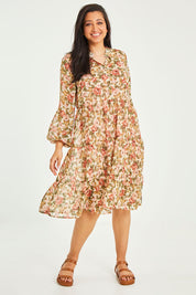 Model Terri-Leigh wearing size 14 of the Floating Through The Day Dress in colour Garden (Pink), from the front, showing the whole outfit