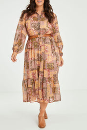 Model Laura wearing size 14 of the Not A Patch On You Dress in colour Muskpatch (Pink), from the front, cropped image