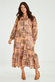 Model Laura wearing size 14 of the Not A Patch On You Dress in colour Muskpatch (Pink), from the front, showing the whole outfit