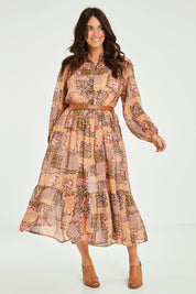 Model Laura wearing size 14 of the Not A Patch On You Dress in colour Muskpatch (Pink), from the front, showing the whole outfit