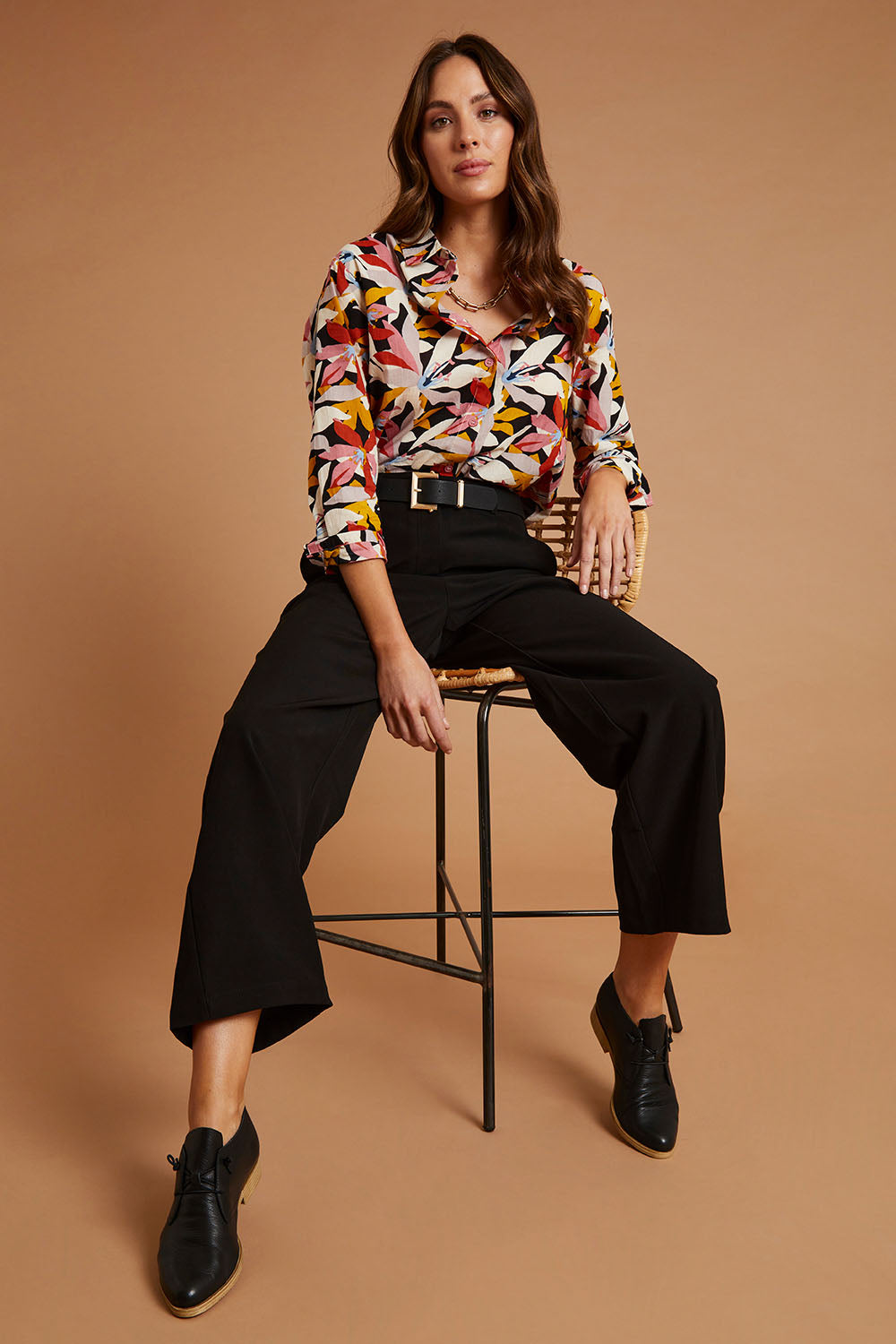 Model Madeline wearing size 10 of the All For Love Pants in colour Black (Black), from the front, showing the whole outfit