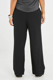 Model Noli wearing size 14 of the All For Love Pants in colour Black (Black), from the back