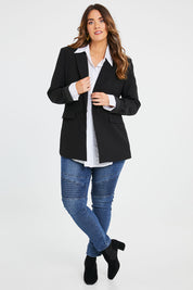 Model Laura wearing size 14 of the All For Love Blazer in colour Black (Black), from the front, showing the whole outfit