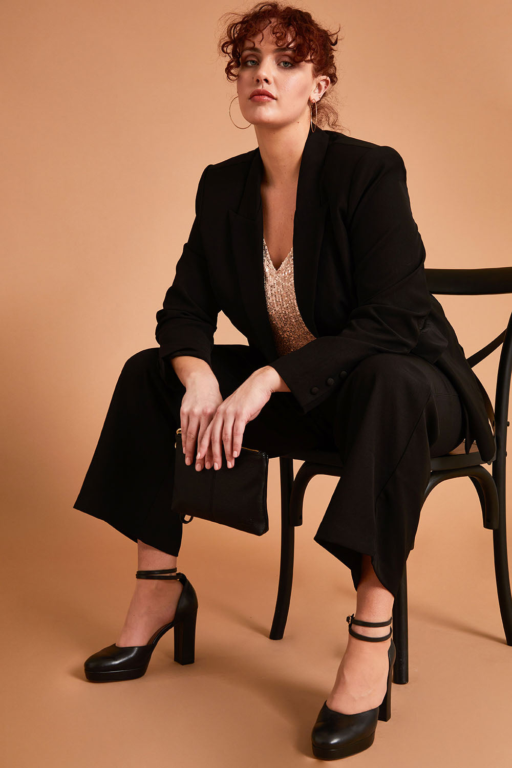 Model Maddy wearing size 16 of the All For Love Blazer in colour Black (Black), from the front, showing the whole outfit