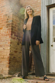 Model Tegan wearing size 10 of the All For Love Blazer in colour Black (Black), from the front, showing the whole outfit
