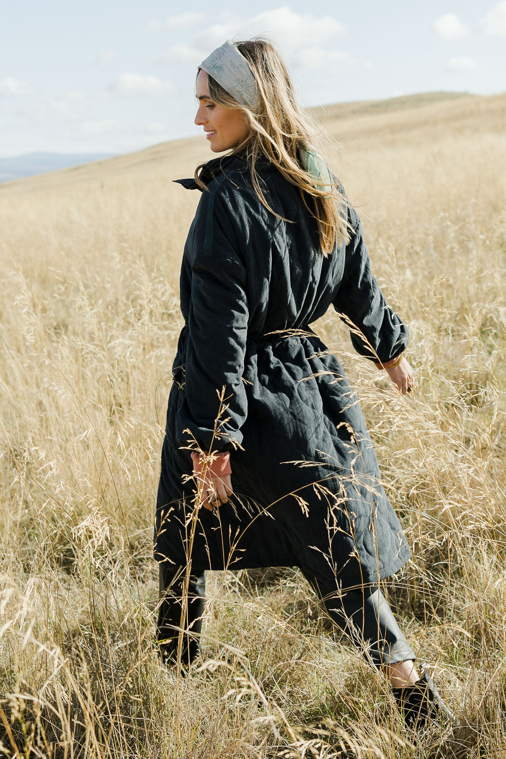 Model Tegan wearing size 10 of the Heart Warming Quilted Anorak in colour Black (Black), from the front, showing the whole outfit