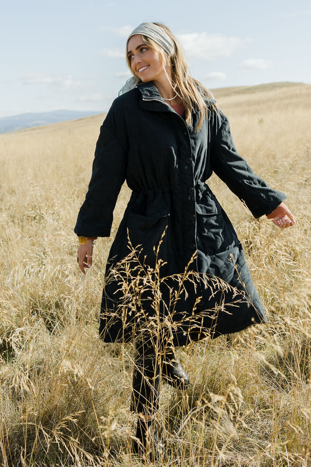 Model Tegan wearing size 10 of the Heart Warming Quilted Anorak in colour Black (Black), from the front, showing the whole outfit