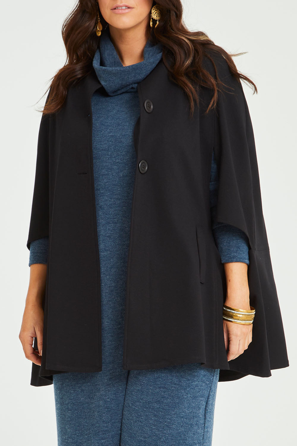 Model Laura wearing size 14 of the Sherlock And I Ponte Cape in colour Black (Black), from the front, cropped image