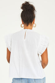 Model Noli wearing size 14 of the Feel Good Friday Blouse in colour Milk (White), from the back