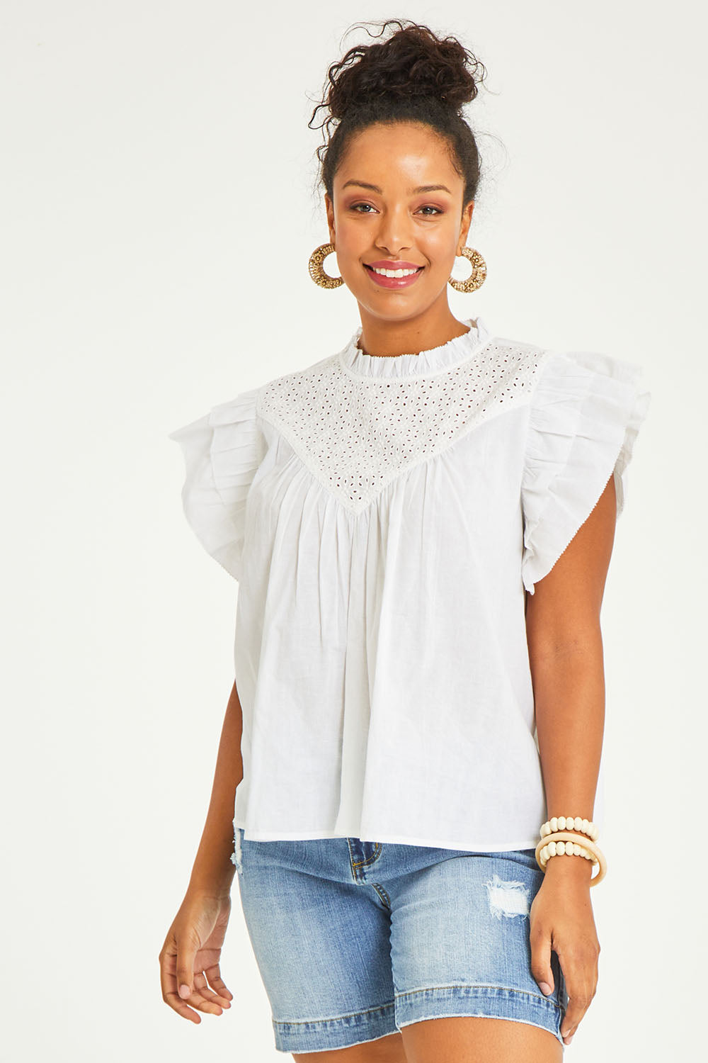 Model Noli wearing size 14 of the Feel Good Friday Blouse in colour Milk (White), from the front, cropped image