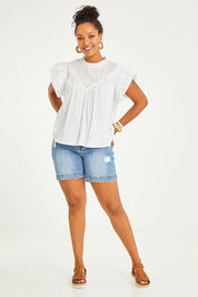 Model Noli wearing size 14 of the Feel Good Friday Blouse in colour Milk (White), from the front, showing the whole outfit