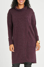 Model Noli wearing size 14 of the Cross My Heart Tunic in colour Wine (Purple), from the front, cropped image