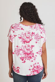 Model Terri-Leigh wearing size 14 of the Falling Flowers Tee in colour Pinkwhite (Pink), from the back