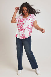 Model Terri-Leigh wearing size 14 of the Falling Flowers Tee in colour Pinkwhite (Pink), from the front, showing the whole outfit