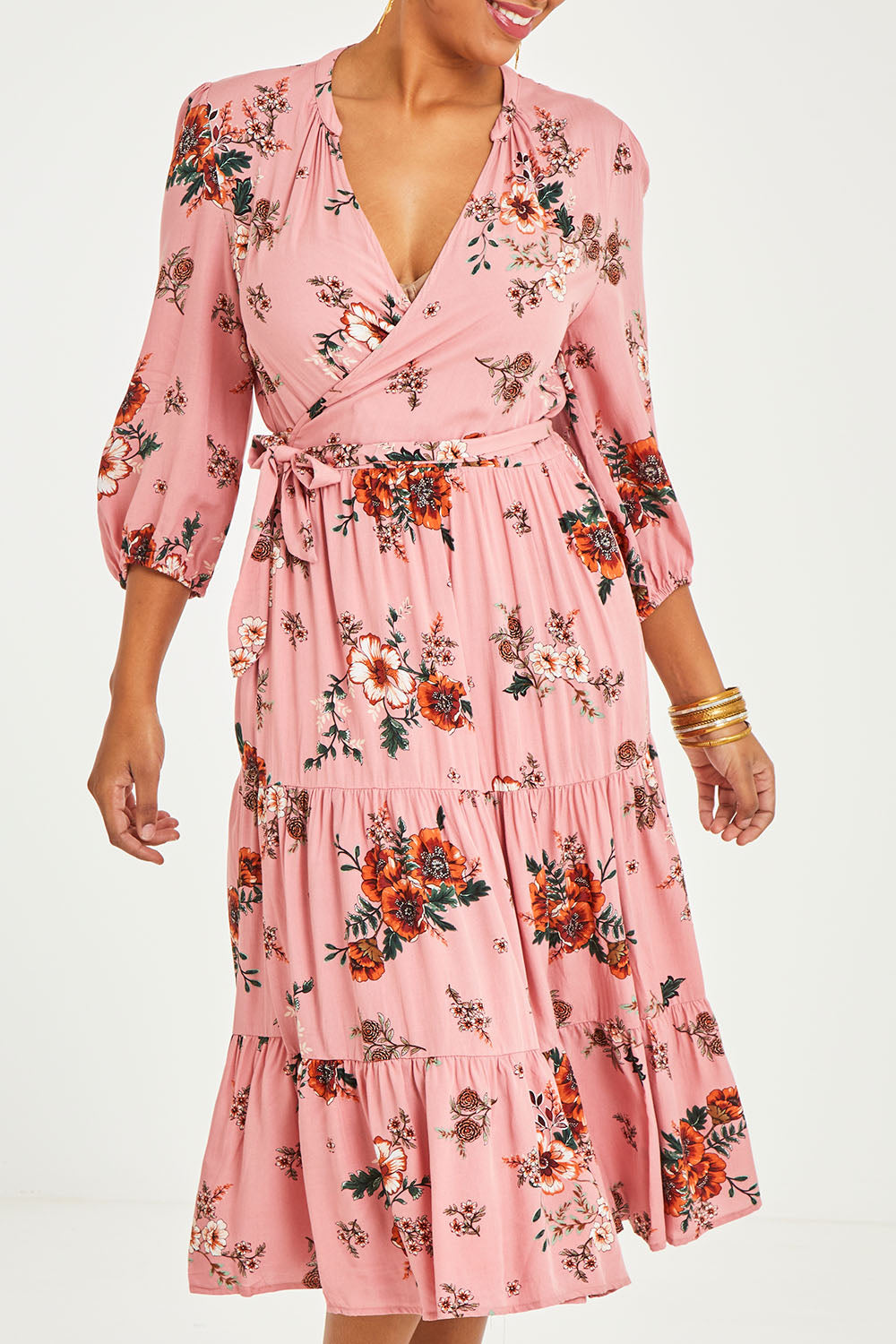 Model Noli wearing size 14 of the Pocket Full Of Dreams Wrap Dress in colour Hibiscus (Pink), from the front, cropped image