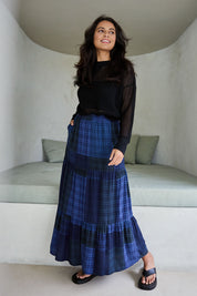Model Tahnee wearing size 10 of the Chasing Sunsets Skirt in colour Bluecheck (Blue), from the front, showing the whole outfit
